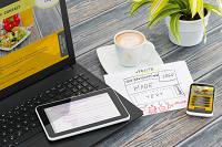 Laptop, tablet, and smartphone sitting on desk